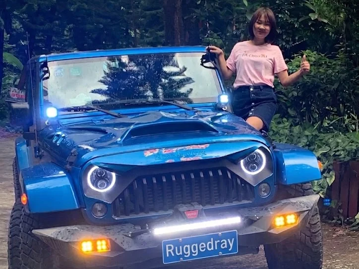 RuggedRay founder with a Jeep Wrangler equipped with RuggedRay off-road lighting
